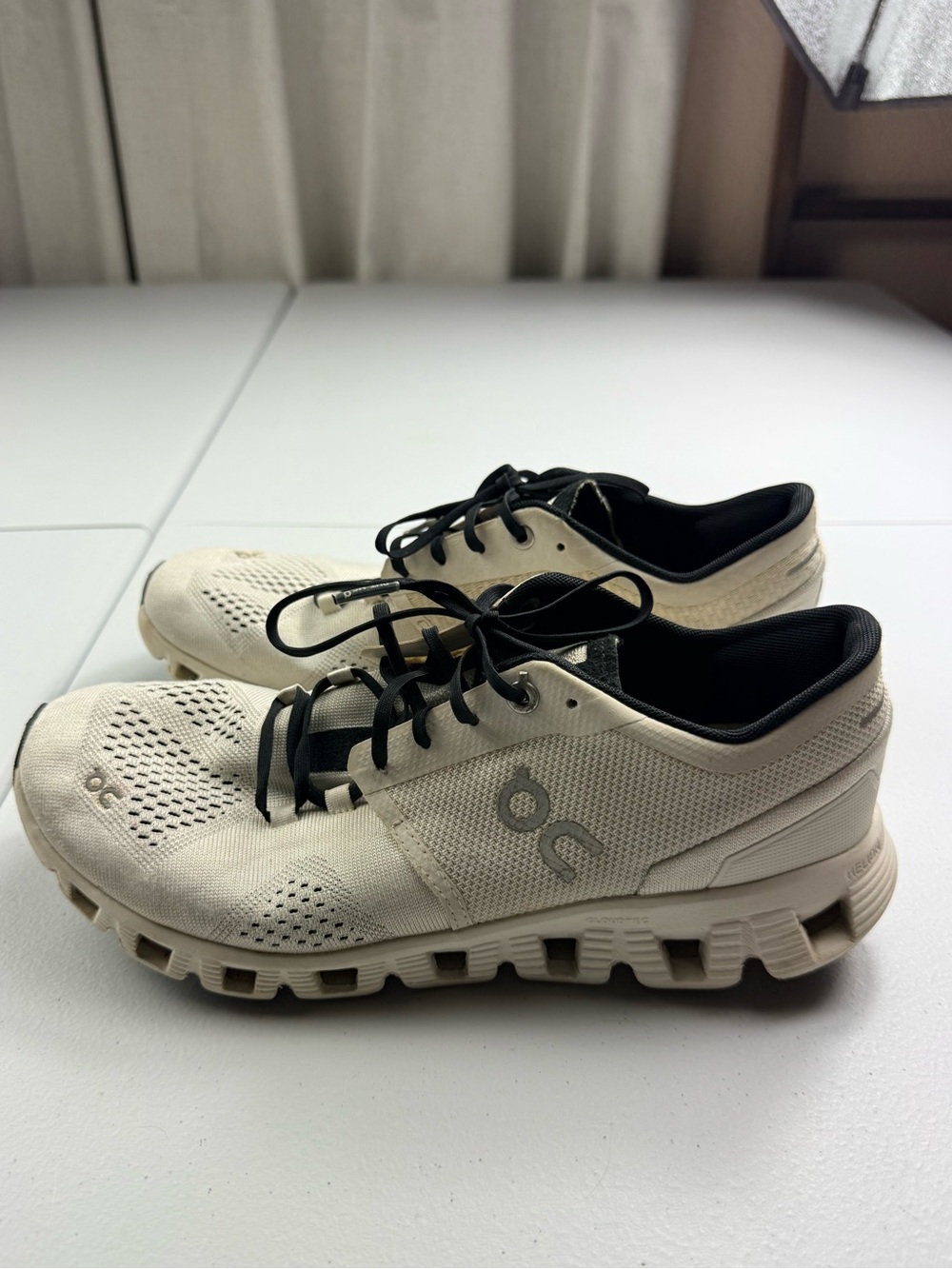 On Running women’s Cream Athletic Sneakers with Black Accents